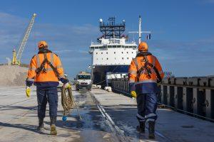 Our values and our missions - two men on the quay at the port of Calais